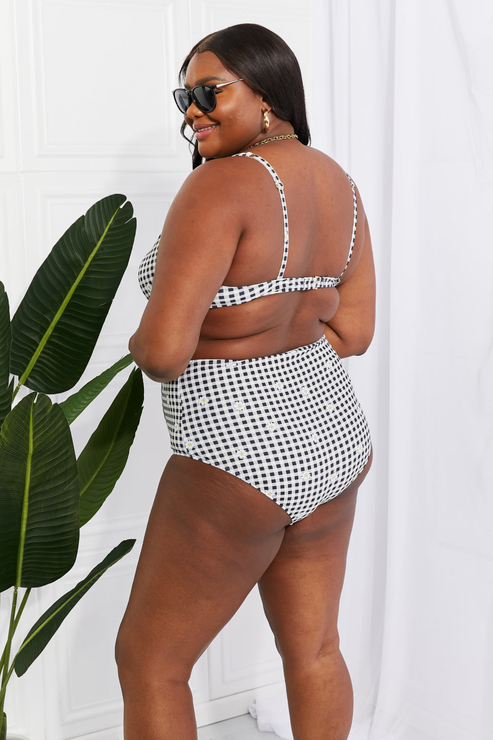 A black twist high-rise bikini, a timeless piece by Marina West Swim