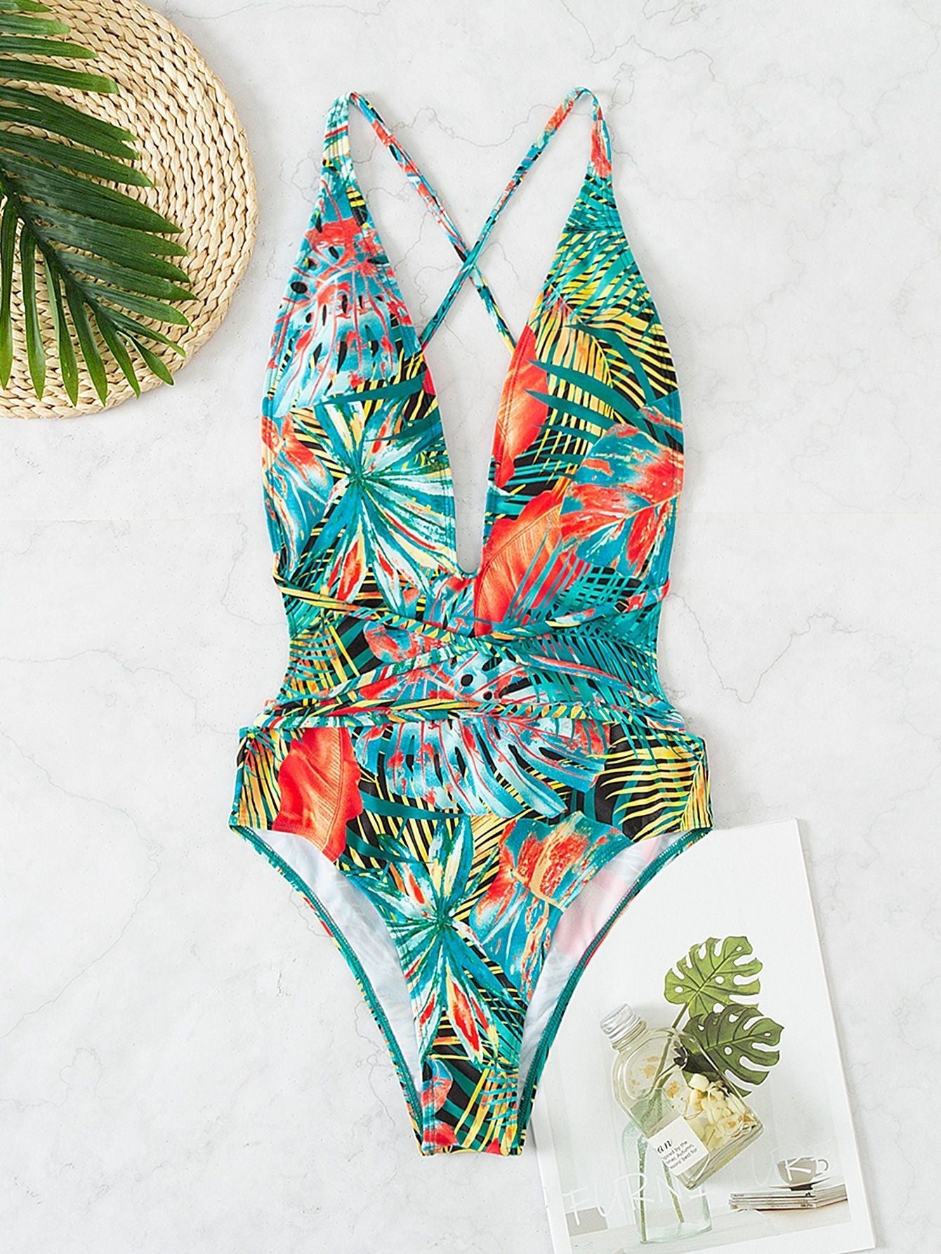 Close-up image of the swimsuit, highlighting the tropical print and its colorful appeal